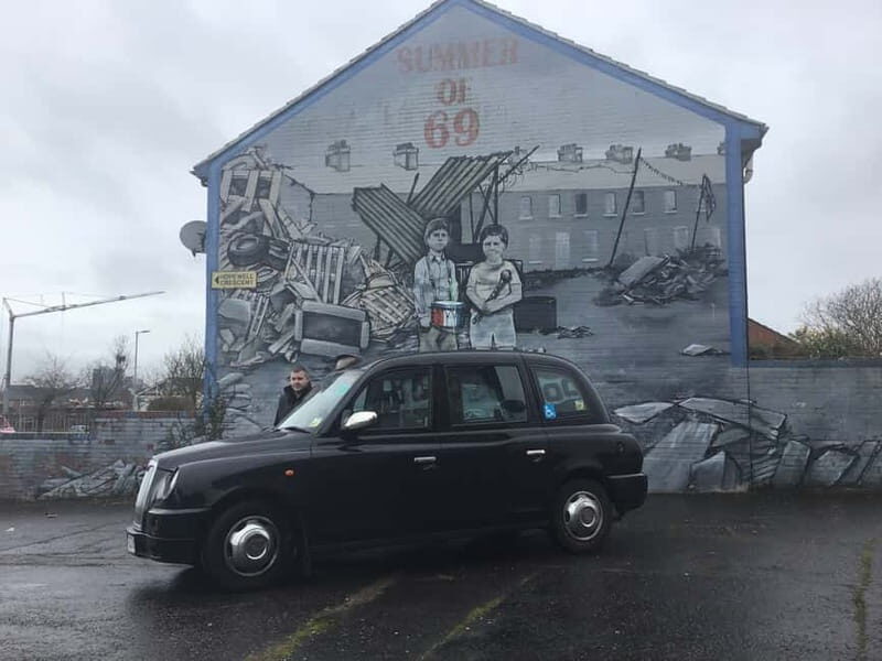 Belfast: Black Taxi Tour & Crumlin Road Jail Tour - Guided Taxi Time: Murals, Identity, and the Peace Wall