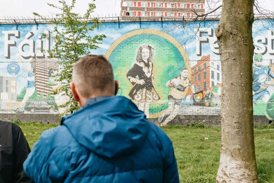 Belfast: The Troubles Walls & Bridges Guided Walking Tour - The Walk Back to the Falls Road: Gates, Ballads, and What You Notice Twice