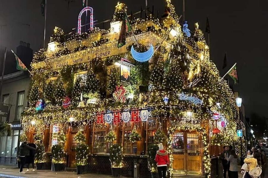 Christmas Lights Taxi Tour with Hotel Pickup - Entering the glass-roof black cab in Christmas mode