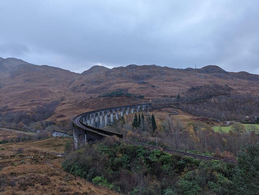 Edinburgh: Harry Potter, Glenfinnan Viaduct & Highland Tour - Glenfinnan Monument, Commando Memorial, and feeding Highland coos
