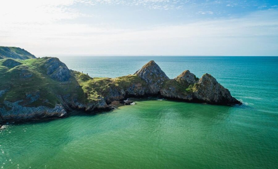 From Cardiff: Mumbles, Three Cliffs, Worms Head Gower Tour - Worms Head: the iconic backdrop, waterfall valleys, and the final plunge