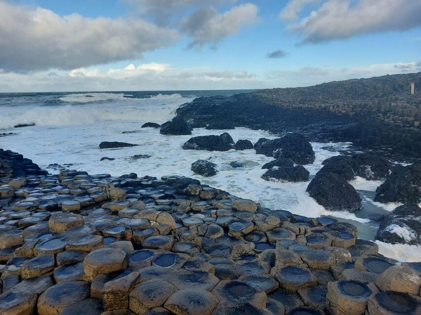 From Dublin: Giants Causeway Private Tour - Dunluce Castle: medieval ruins and Game of Thrones scenery