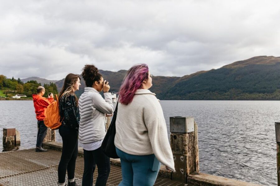 From Glasgow: Oban, Glencoe, Highland Lochs & Castles Tour - Loch Lomond: lochside village views and Ben Lomond in the frame