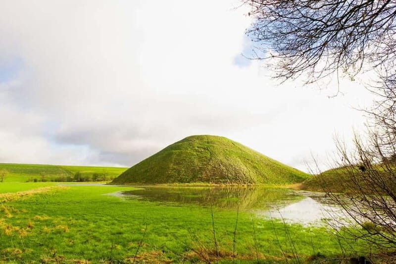 From London: Stonehenge & The Stone Circles of Avebury Tour - West Kennet Long Barrow: entering the Neolithic burial chambers